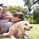 RSPCA launches #AnimalKind campaign Family Relaxing In Garden With Pet Dog