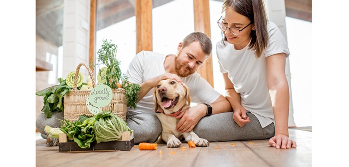 Couple with dog and vegetables